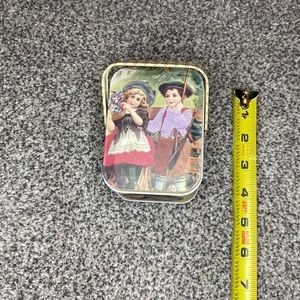 Small tin with basket handles